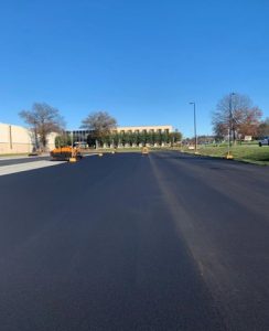 Freshly paved commercial roadway and parking area