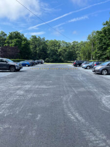 Freshly resurfaced commercial parking lot asphalt paving project