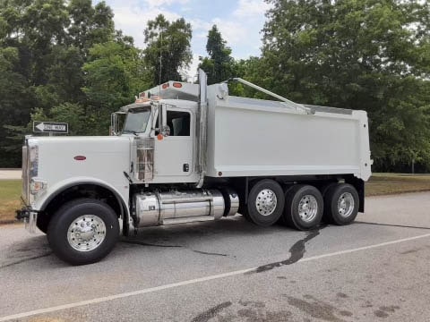 Industrial dump truck for asphalt paving and road construction