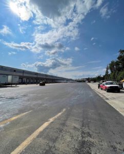 Commercial asphalt parking lot with newly resurfaced pavement