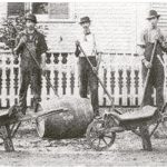 Vintage paving crew loading asphalt materials into work truck